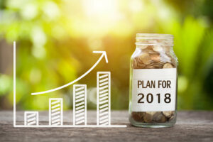 copyright-Fotolia.com-170206268-plan-for-2018-word-with-coin-in-glass-jar-and-graph-up